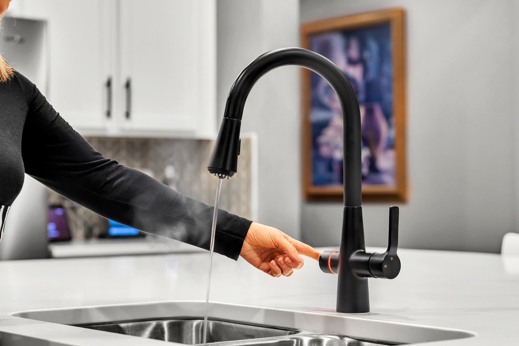 Instant hot water, filtered water, full-flow tap, and pull-down spray. All-in-one faucet for home, RV, and marine sinks.